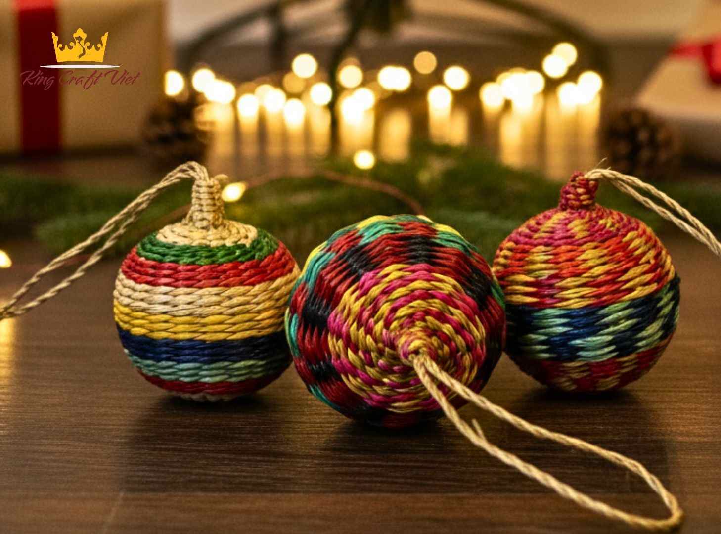 Close-up of colorful handmade seagrass Christmas ball with striped pattern.