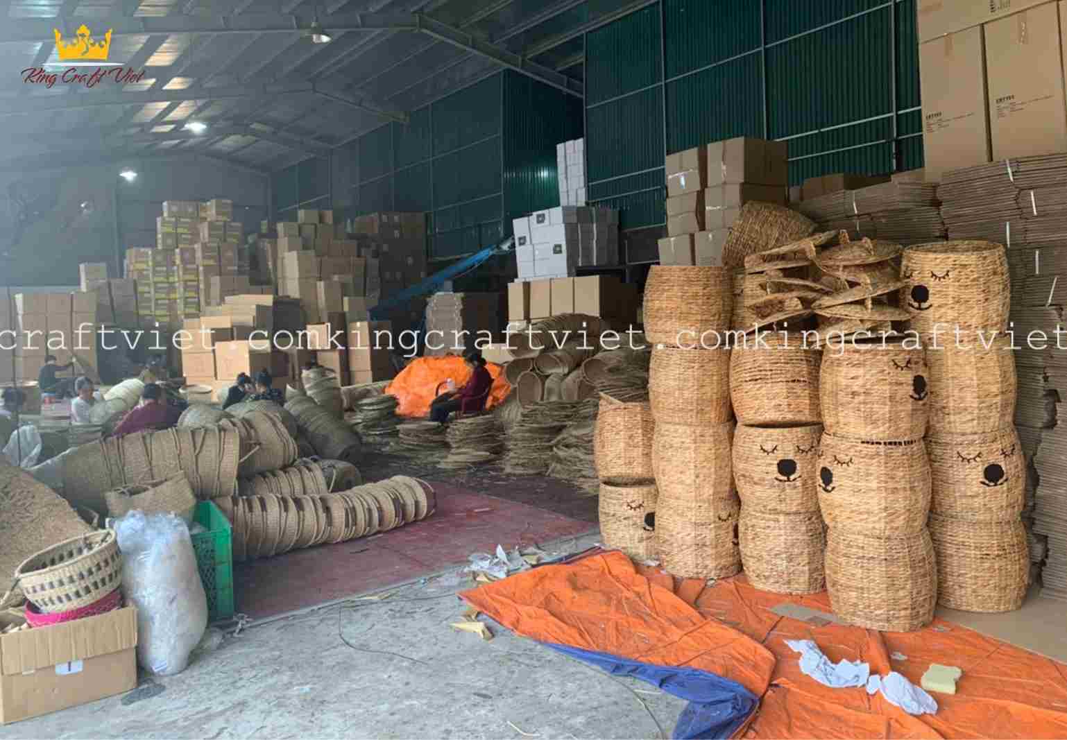 Vietnamese artisans weaving natural fiber baskets handmade craft village